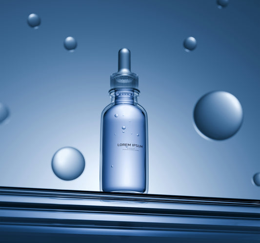 Clear serum bottle with bubbles on blue background
